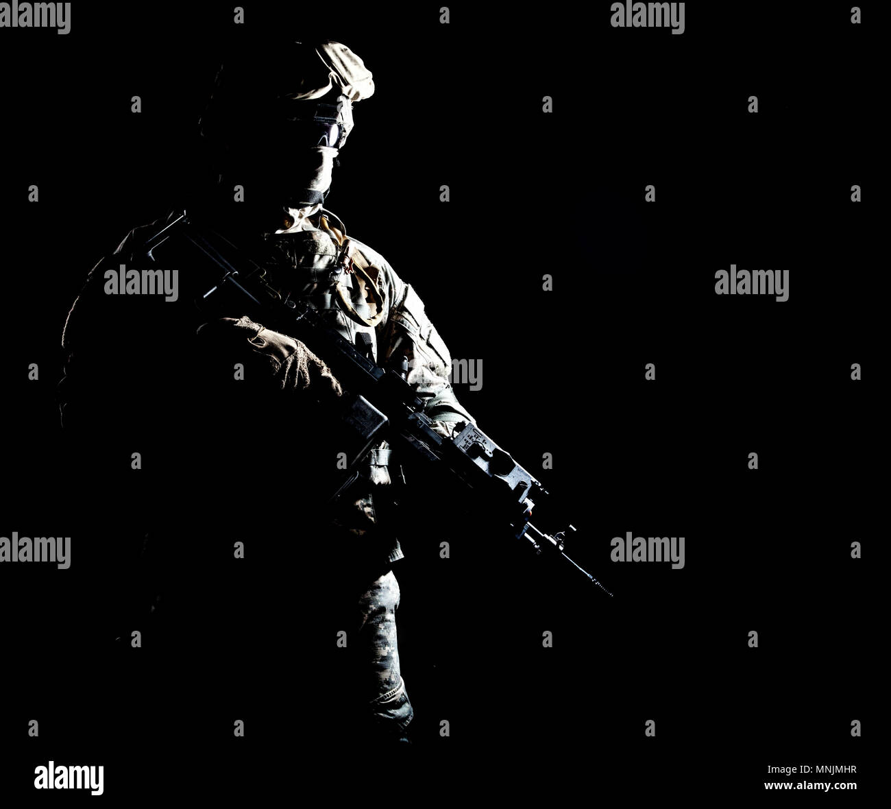 Armed infantryman during night military operation Stock Photo