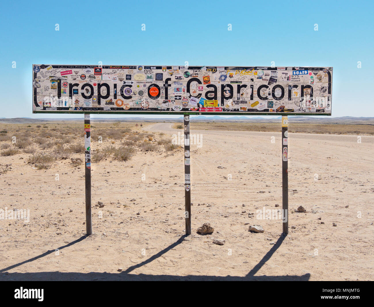 Road through Namib-Naukluft National Park, Tropic of Capricorn sign Stock Photo