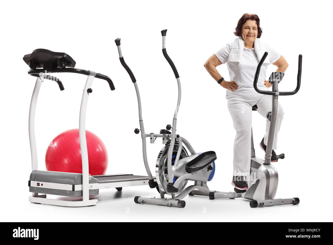 Elderly woman with exercise machines isolated on white background Stock Photo