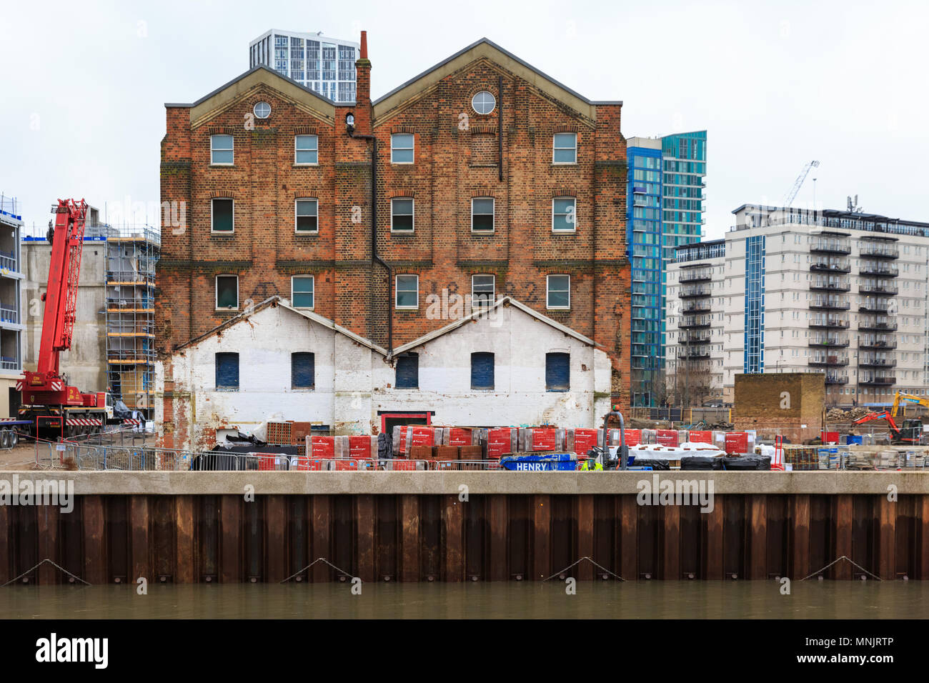 Old buildings and warehouse by the Three Mills Wall River in East London, UK Stock Photo