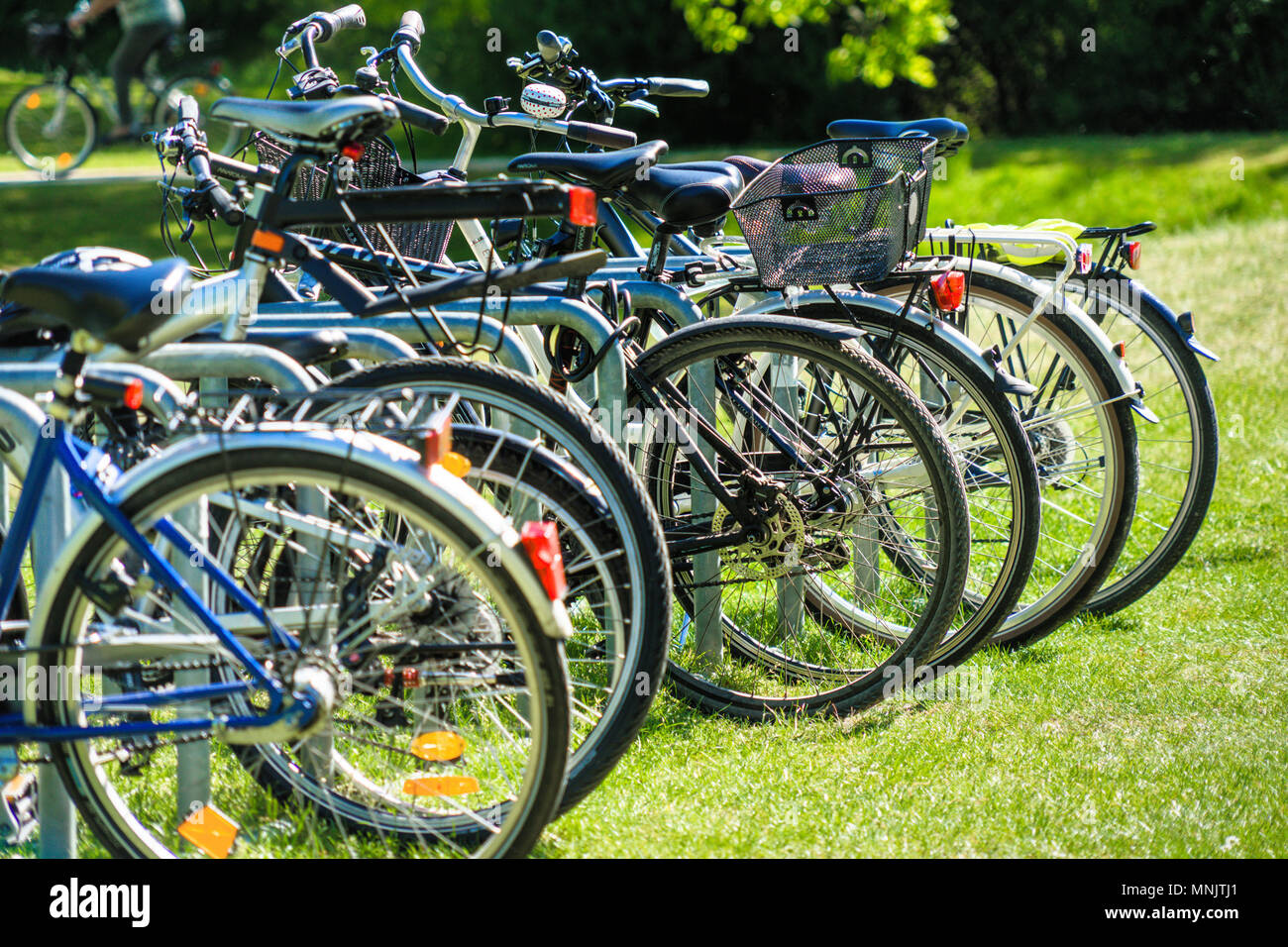 Wolfsburg, lower saxony, germany, May 5, 2018: Abstracted image with intentionally low depth of field from a group of bicycles parked on the lawn of a Stock Photo