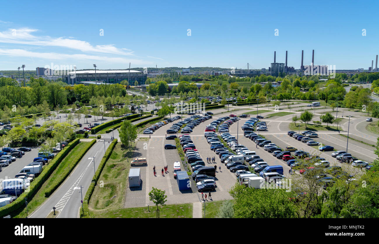 Wolfsburg, lower saxony, germany, May 5., 2018: Aerial view over a large parking lot with many parked cars onto a football stadium and the Volkswagen  Stock Photo