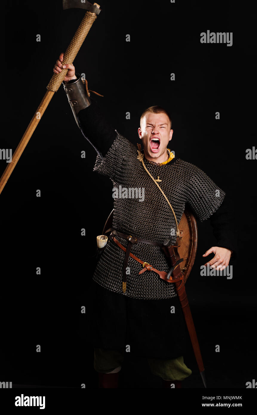 Medieval Viking armored attack with a battle-ax. Stock Photo
