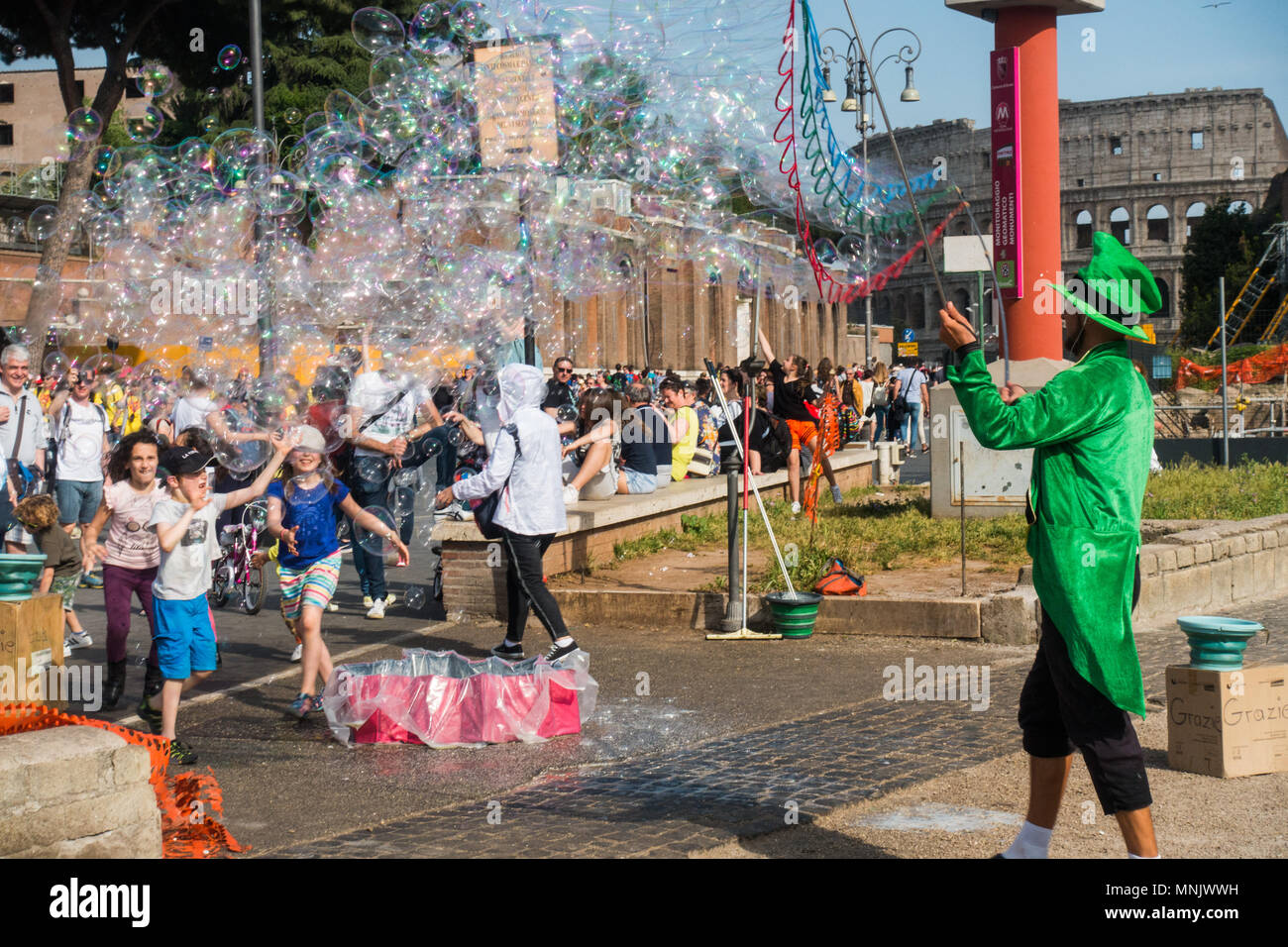 Rome Italy Street Artist doing big soap bubbles to entertain kids Stock ...