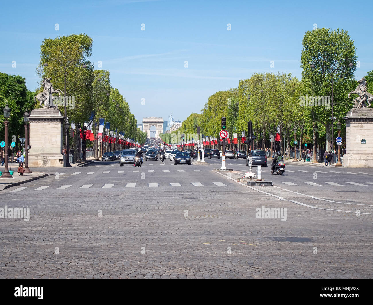 PARIS, FRANCE-MAY 5, 2016: Avenue des Champs-Elysees looking west from Place de la Concorde Stock Photo