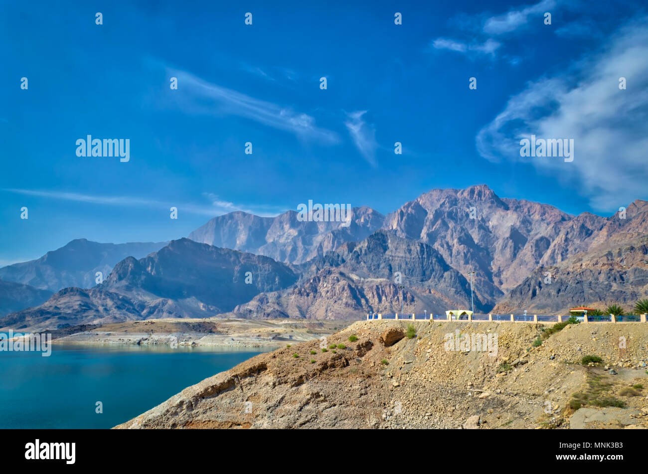 Muscat landscape of mountains, blue sky and water. Peace and tranquility. Stock Photo