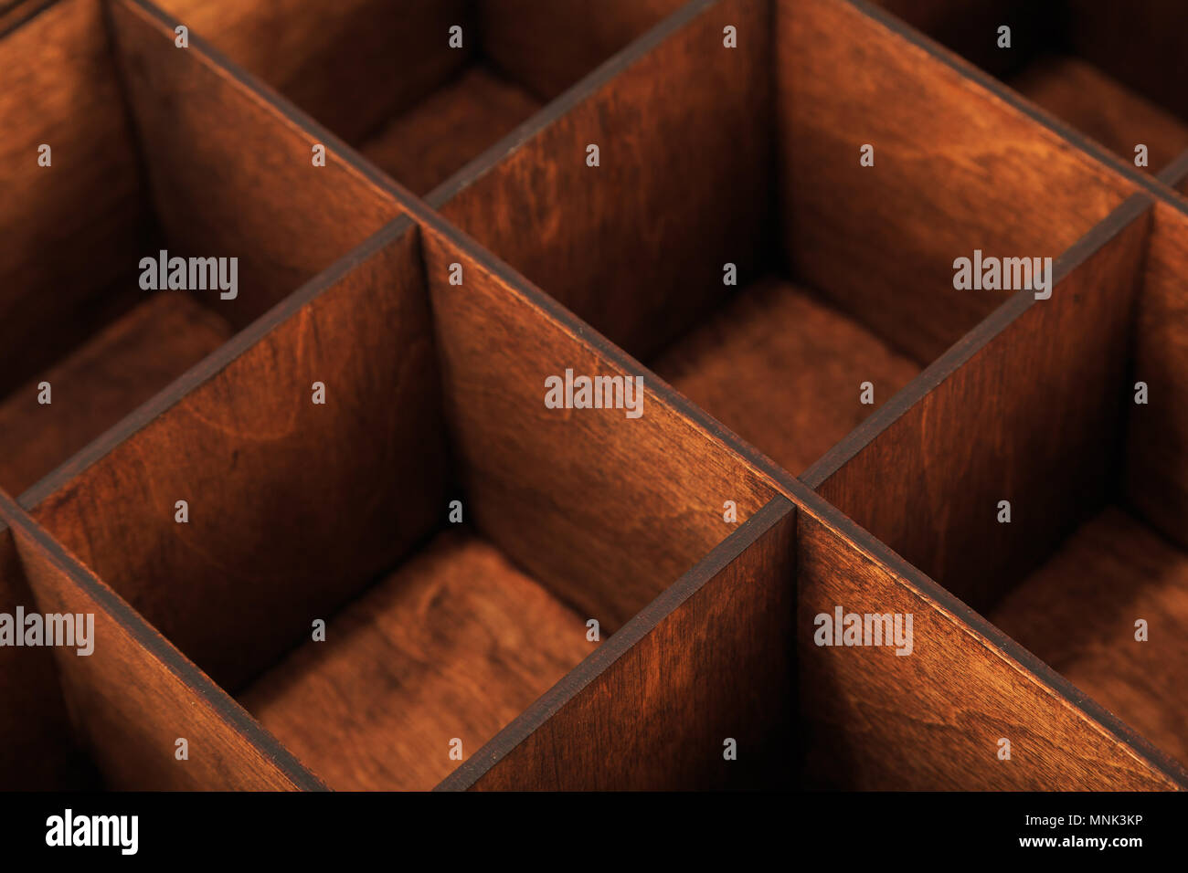 Wooden box for storing utensils with cells Stock Photo Alamy