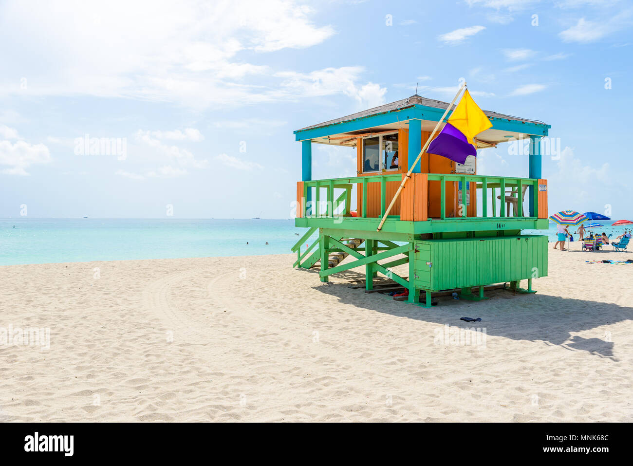 Miami South Beach, lifeguard house in a colorful Art Deco style at sunny summer day with the Caribbean sea in background, world famous travel location Stock Photo