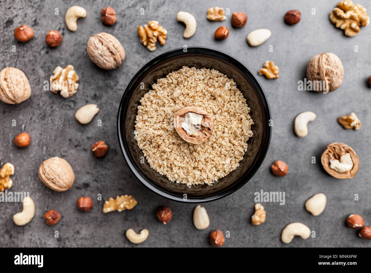Delicious walnuts on grey rustic background Stock Photo