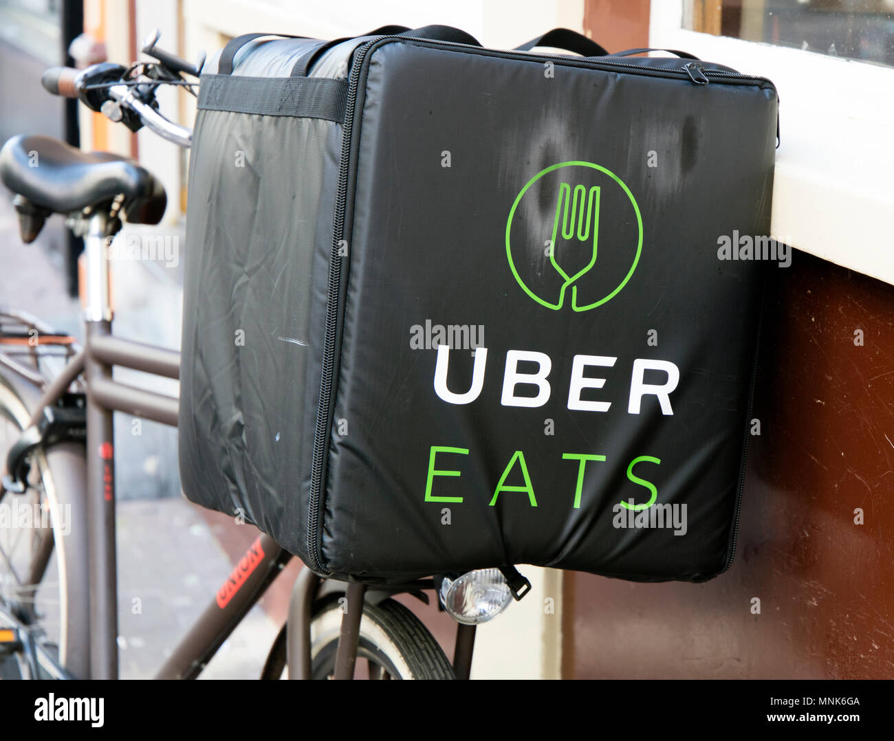 Amsterdam, Netherlands-april 9, 2017: Uber eats bicycle in a street of amsterdam Stock Photo