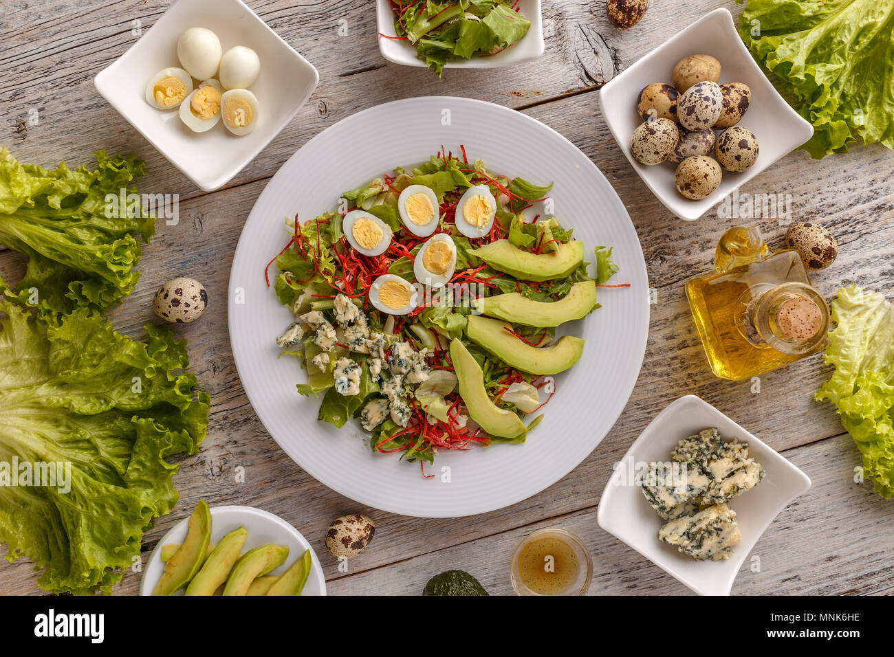 Healthy lunch plate, avocado, quail egg and blue cheese salad Stock Photo