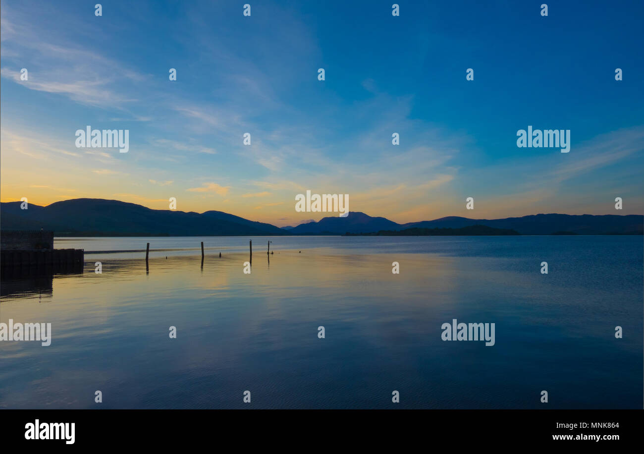 Loch Lomond sunset, tranquil landscape on the bonnie banks. Stock Photo