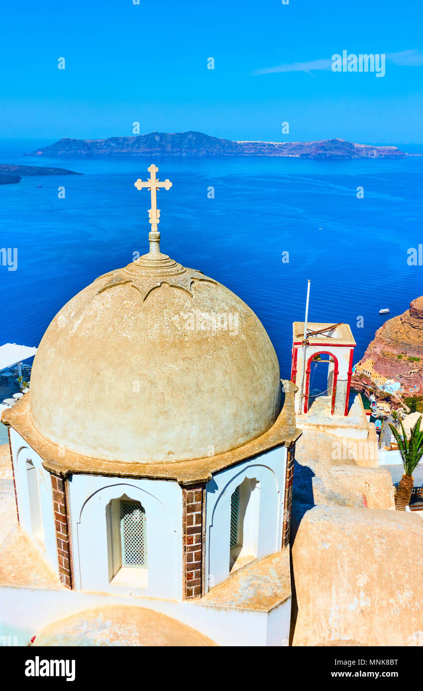 Dome of old greek church in Thira town and Aegean sea, Santorini, Greece Stock Photo