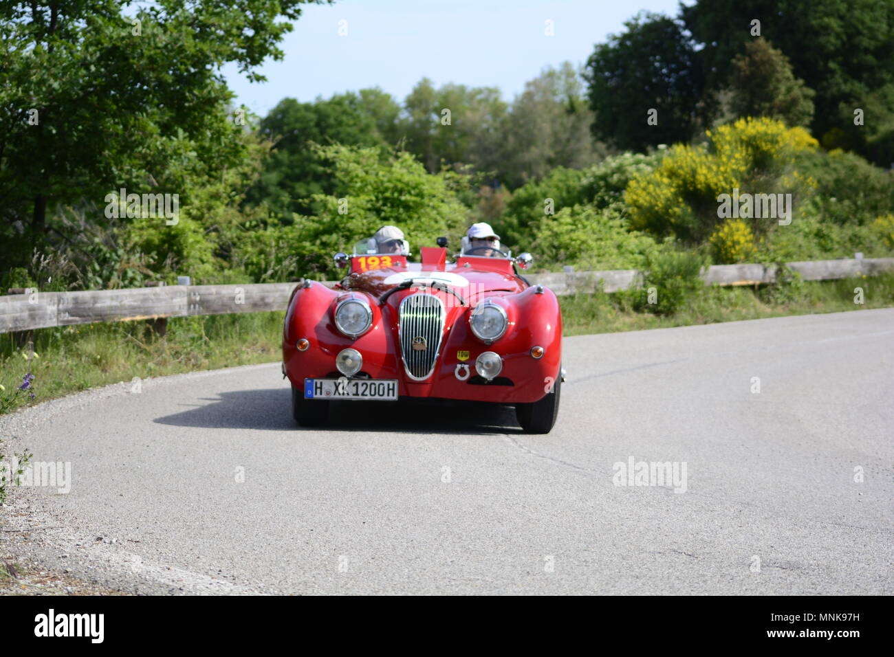 PESARO COLLE SAN BARTOLO , ITALY - MAY 17 - 2018 : AGUAR XK 120 OTS1950  on an old racing car in rally Mille Miglia 2018 the famous italia Stock Photo