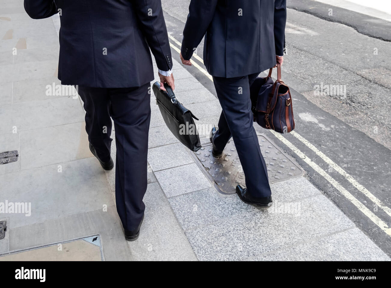 Men in suits walking hi-res stock photography and images - Alamy