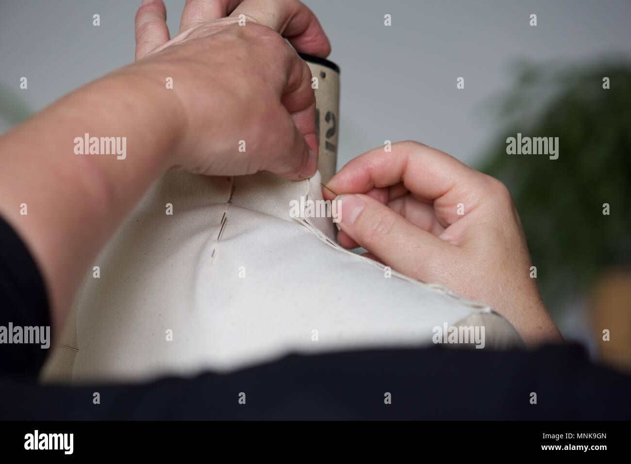 Pattern Maker (Fashion) a real Pattern Maker/Pattern Cutter at work on a calico toile on a
