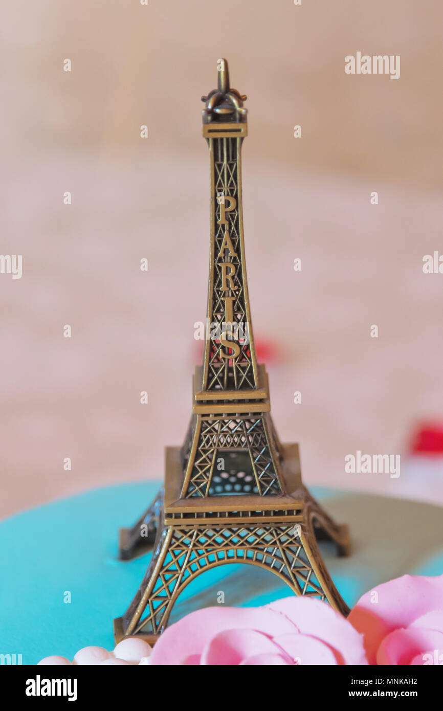 Eiffel tower souvenir toy, isolated on a yellow background Stock Photo ...