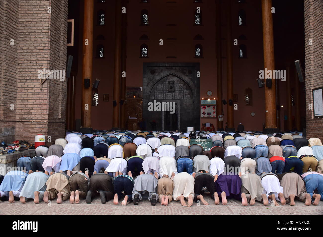 Kashmiri Muslims prays on the first Friday of the holy fasting month of Ramadan in the garden of Jamia Masjid or Grand Mosque. Islam's holiest month of Ramadan is a period of intense prayer, dawn-to-dusk fasting and nightly feasts. Stock Photo