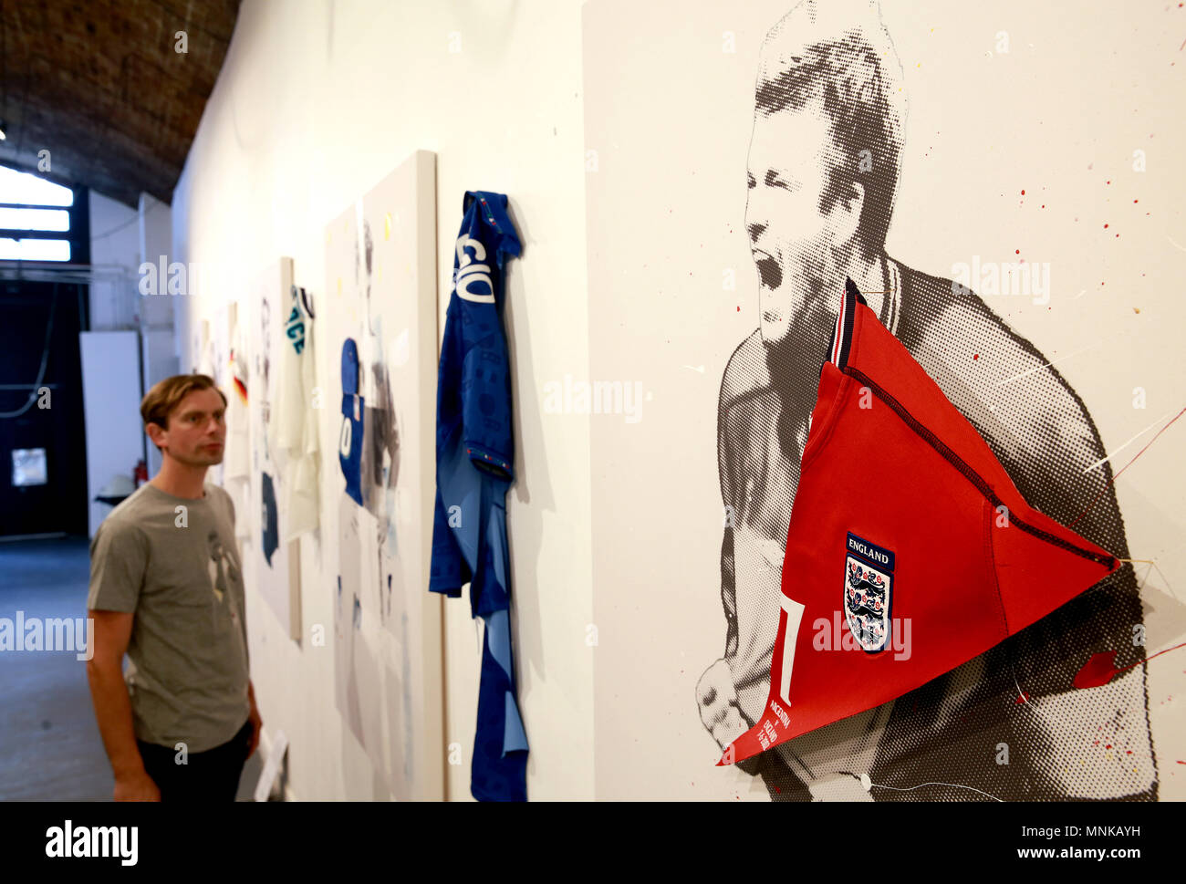 Members of the public view the Art of football World In Colour