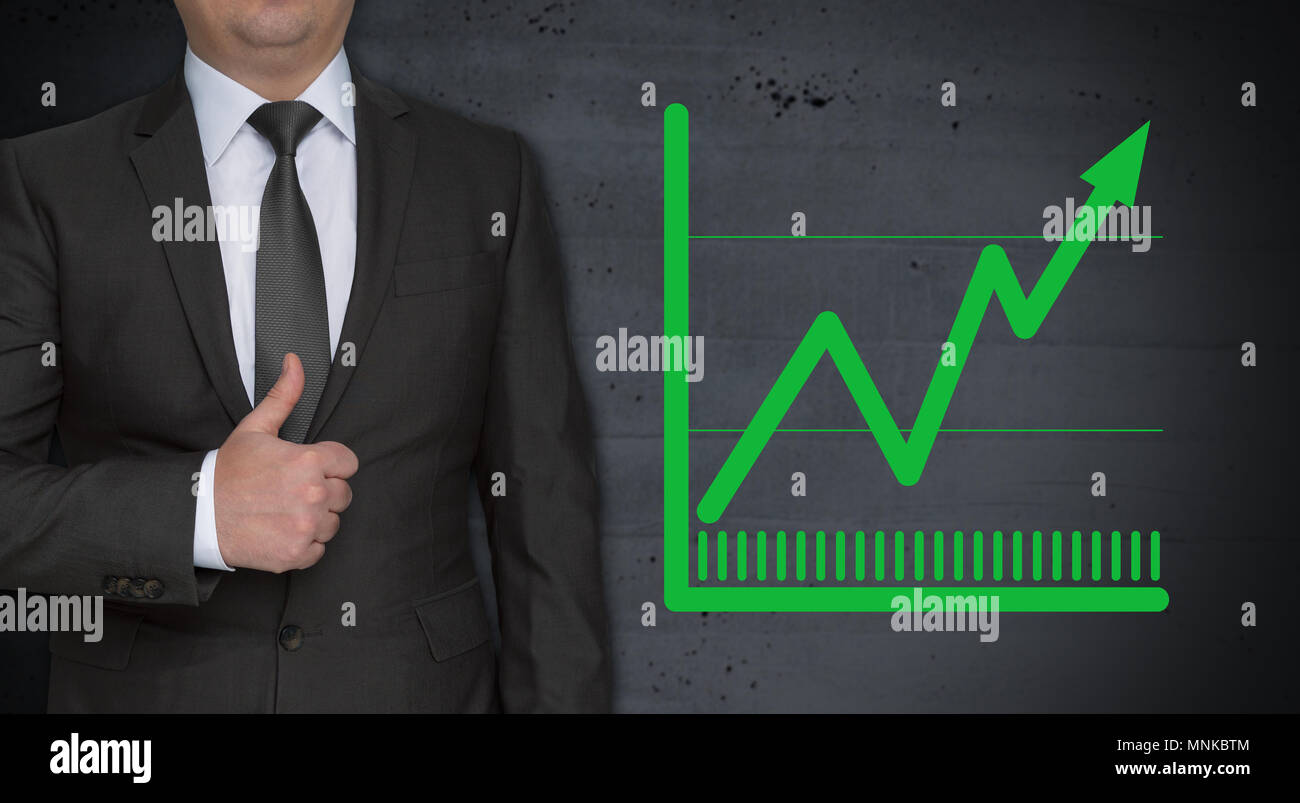 Chart concept and businessman with thumbs up Stock Photo - Alamy