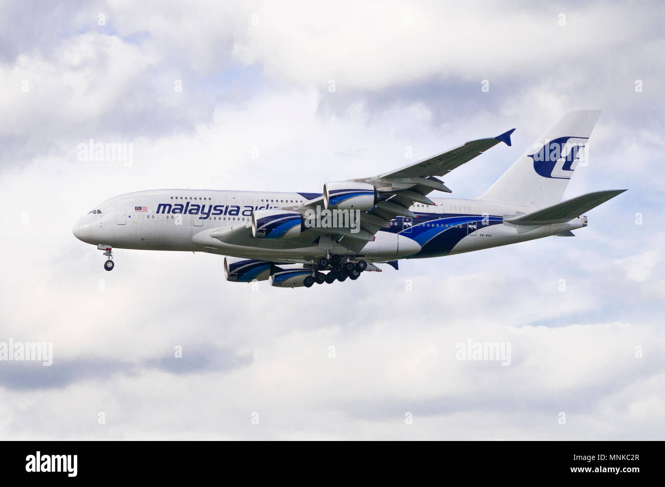 London, Uk - August 6, 2013 - A Malaysian Airlines A380-841 lands at Heathrow Airport in London Stock Photo