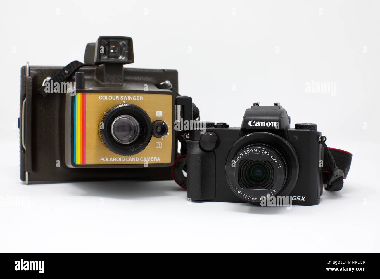 1975 Polaroid Colour Swinger Camera next to a modern Canon PowerShot G5 X  Camera Stock Photo - Alamy