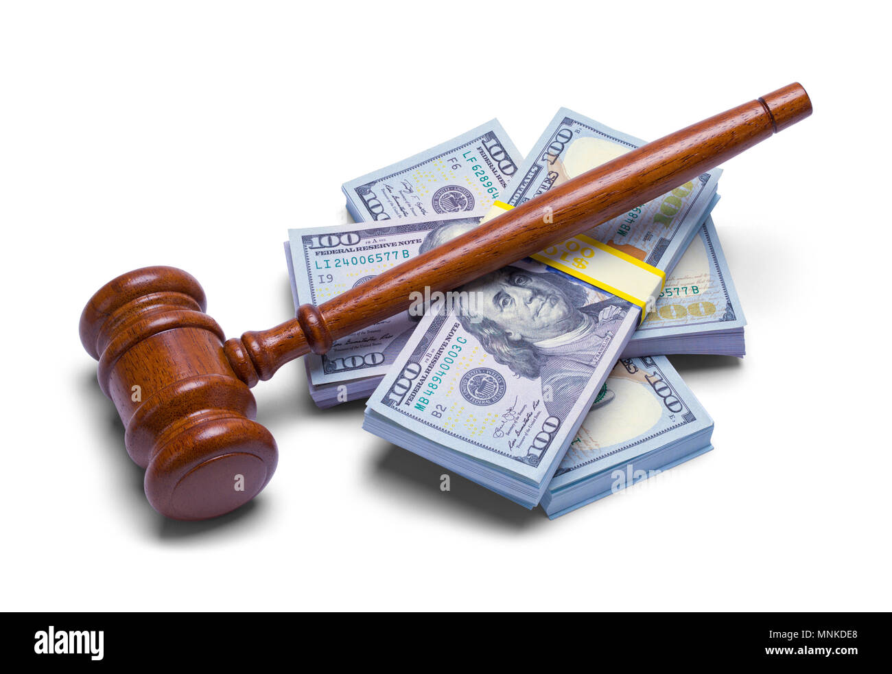 Judges Gavel with Stack of Money Isolated on a White Background. Stock Photo