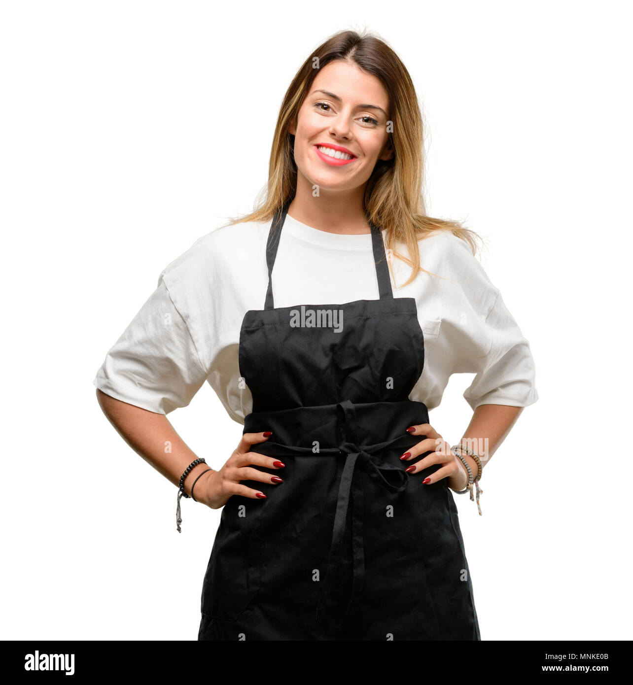 Shop owner woman wearing apron confident and happy with a big natural smile laughing Stock Photo