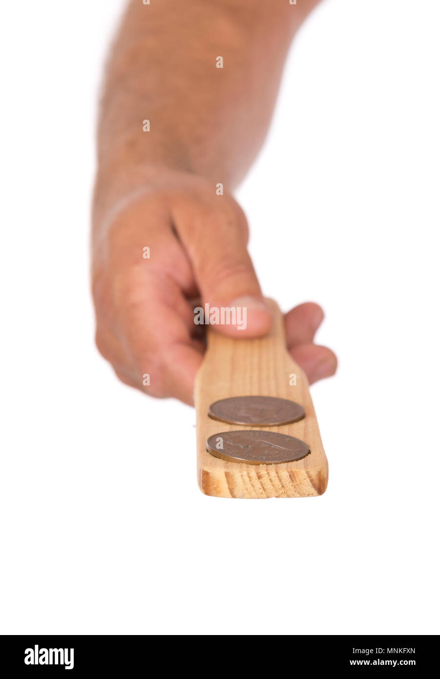 A hand tossing Pennies for a Two Up game, Australian Culture. Stock Photo