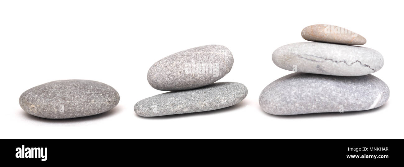 Piles of stones isolated on white background Stock Photo - Alamy