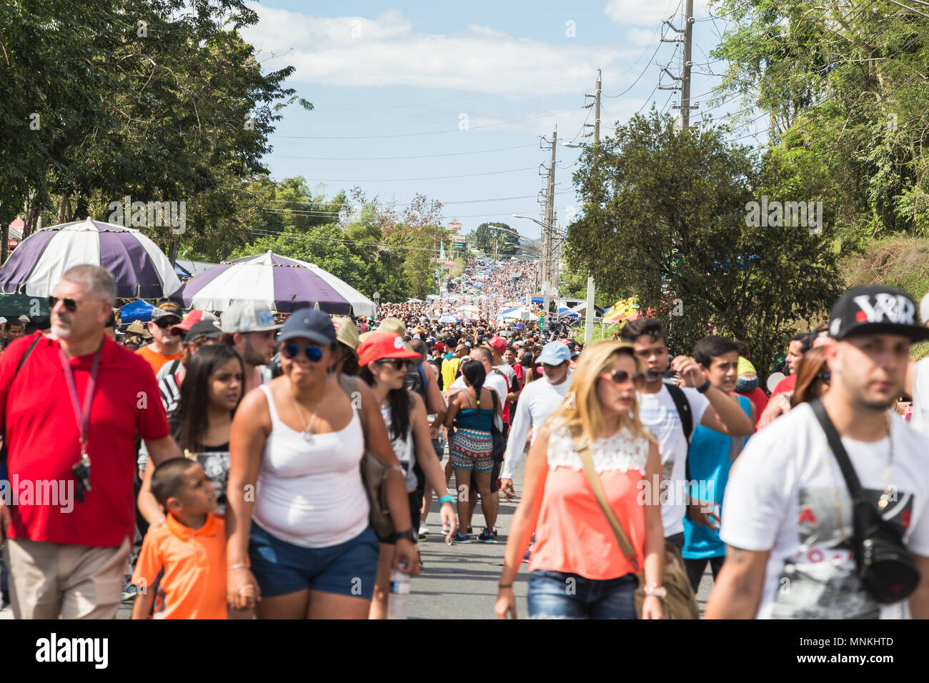 Visitors fill the Main Street where a parade takes place for anual festival, Festival de la Novella, San Sebastian, Puerto Rico. Stock Photo