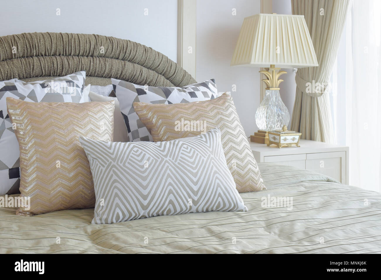 Graphic Pattern Silver And Golden Pillows Setting On Bed With Light Gold Color Blanket In Classic Style Bedroom Stock Photo Alamy