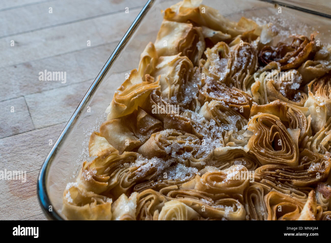 Turkish dessert From Artvin called Silor / Rolled and Fried phyllo with powdered sugar. Stock Photo