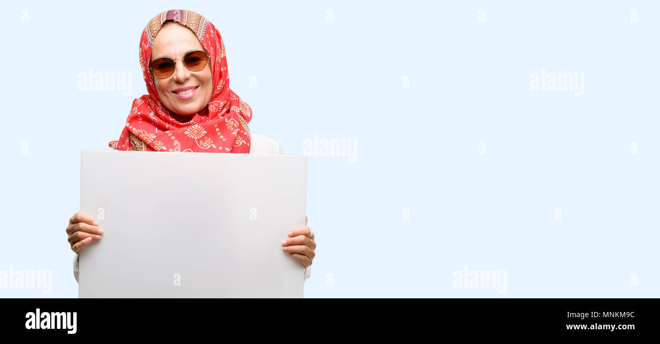 Middle Age Muslim Arab Woman Wearing Hijab Holding Blank Advertising Banner Good Poster For Ad Offer Or Announcement Big Paper Billboard Isolated B Stock Photo Alamy