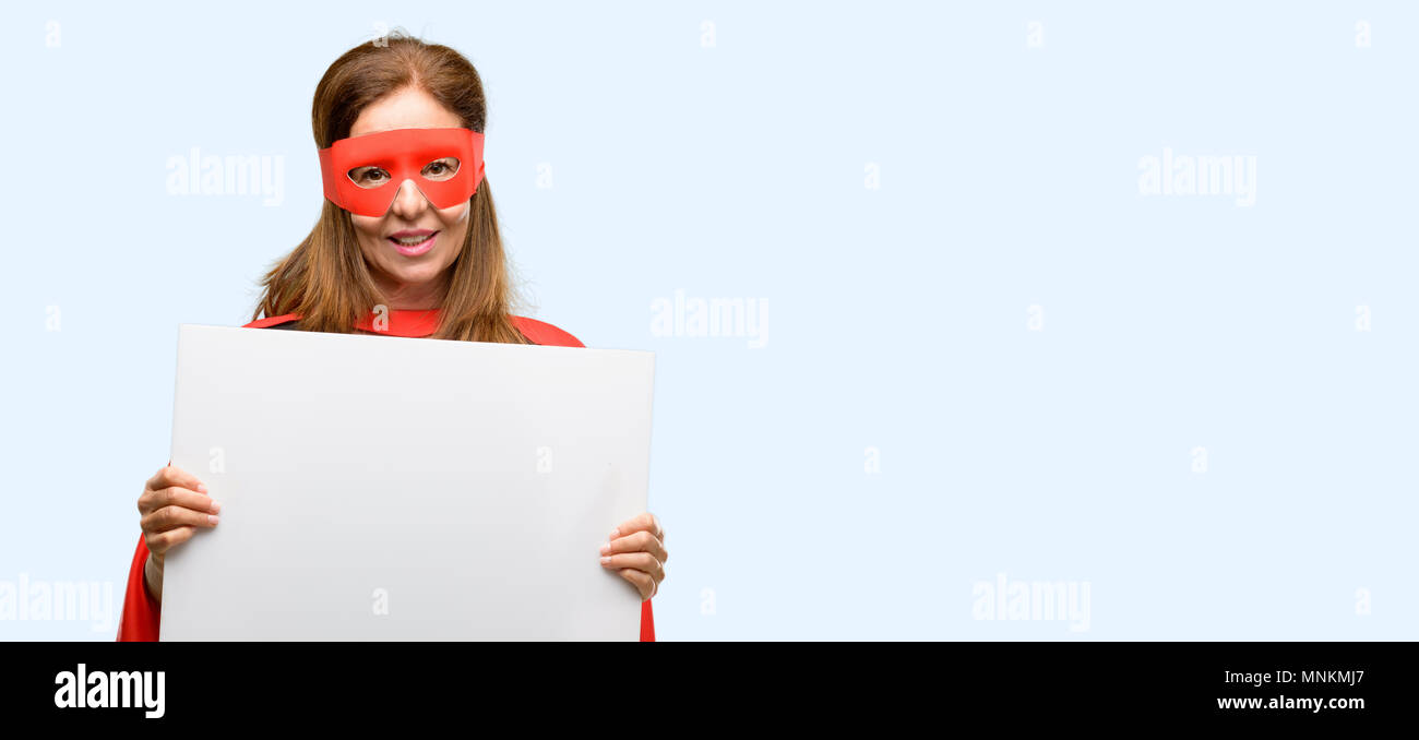 Middle Age Super Hero Woman Wearing Red Mask And Cape Holding