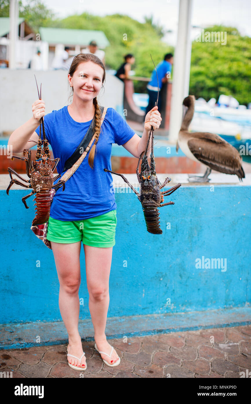 Woman holding fresh lobsters at seafood market Stock Photo Alamy