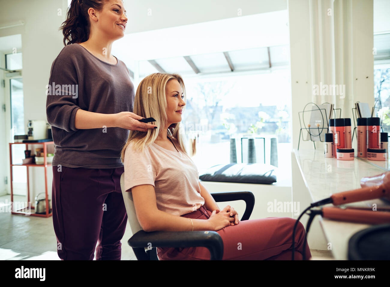 Woman in salon chair hi-res stock photography and images - Alamy