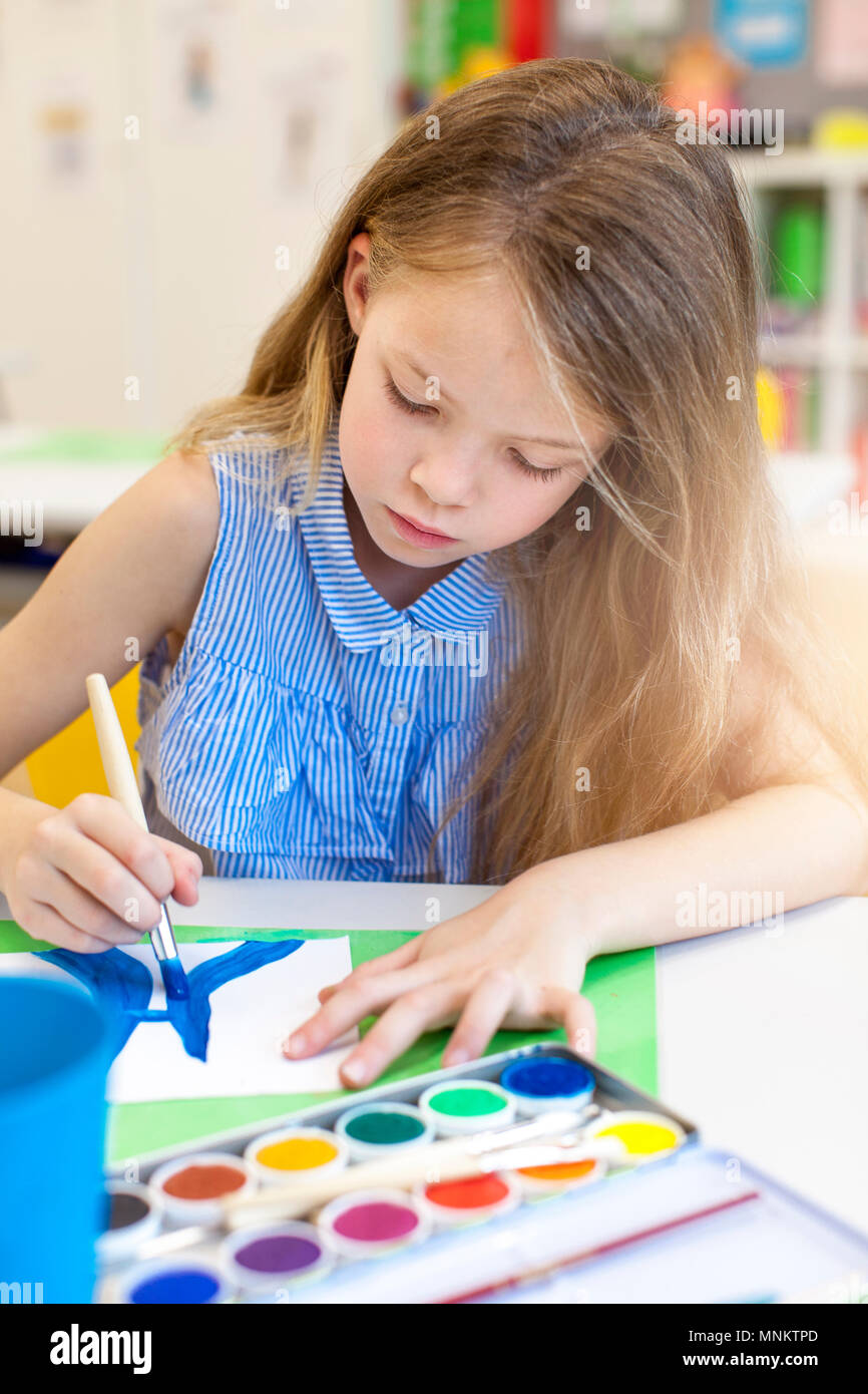 At school - pretty schoolgirl is drawing in the painting lessons Stock ...