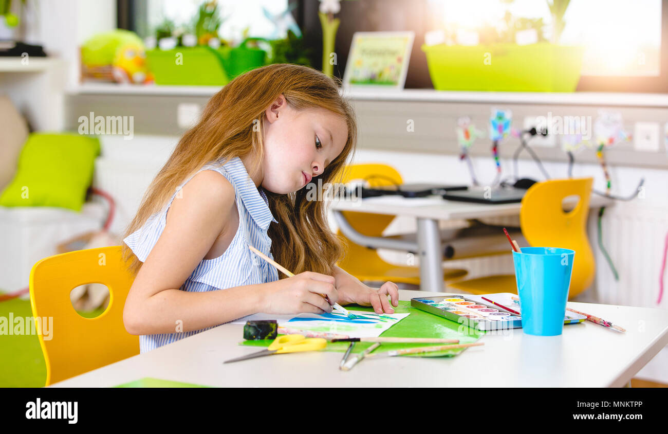 At school - pretty schoolgirl is drawing in the painting lessons Stock ...
