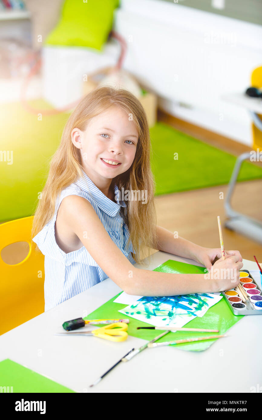 At school - pretty schoolgirl is drawing in the painting lessons Stock ...