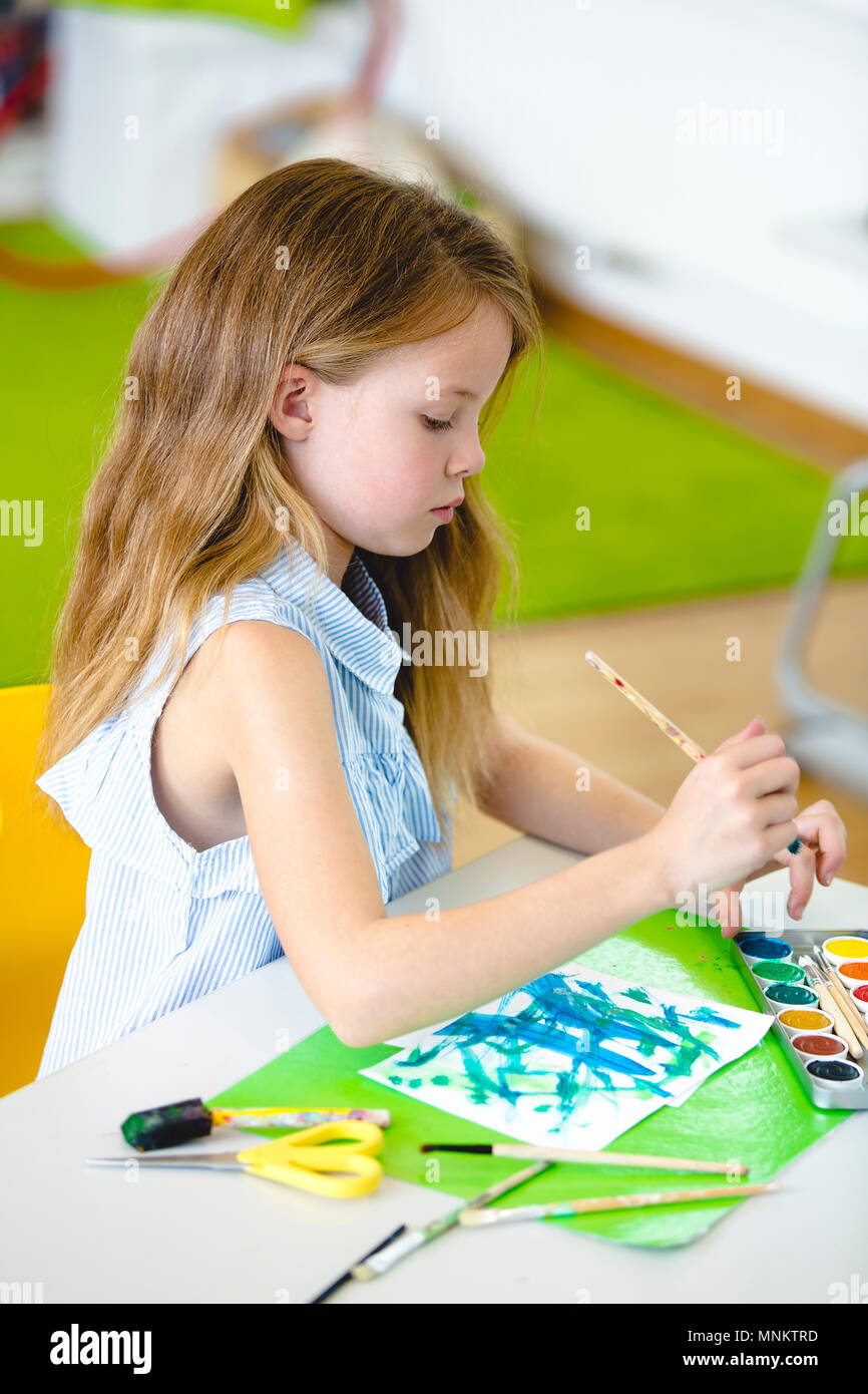 At school - pretty schoolgirl is drawing in the painting lessons Stock ...