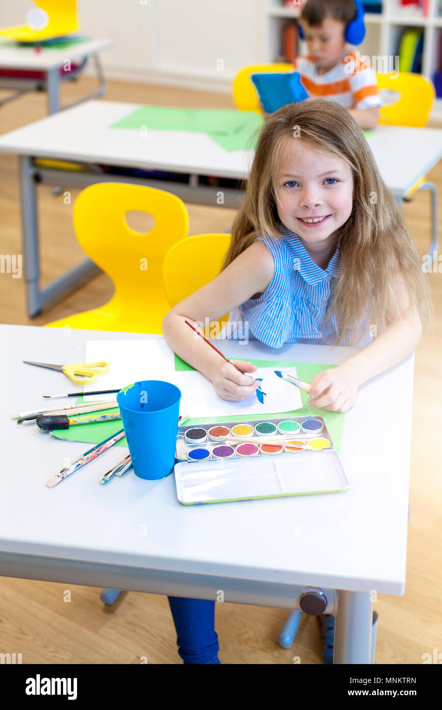 At school - pretty schoolgirl is drawing in the painting lessons Stock ...