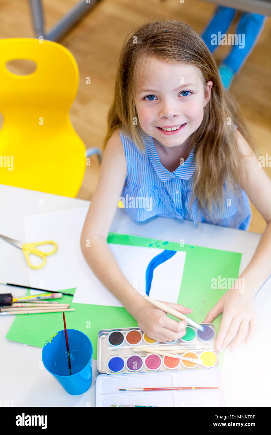 At school - pretty schoolgirl is drawing in the painting lessons Stock ...