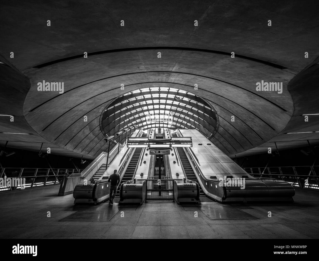 Escalators in entrance to Jubilee line tube station, Canary Wharf, London, UK. Stock Photo