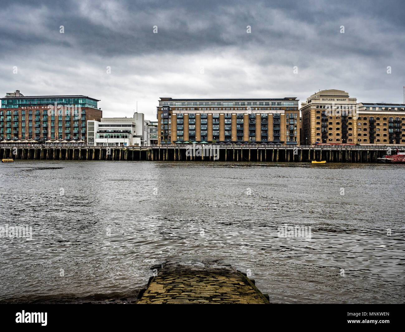Butlers Wharf on the south side of the river Thames, viewed from the North shore, London, UK. Stock Photo
