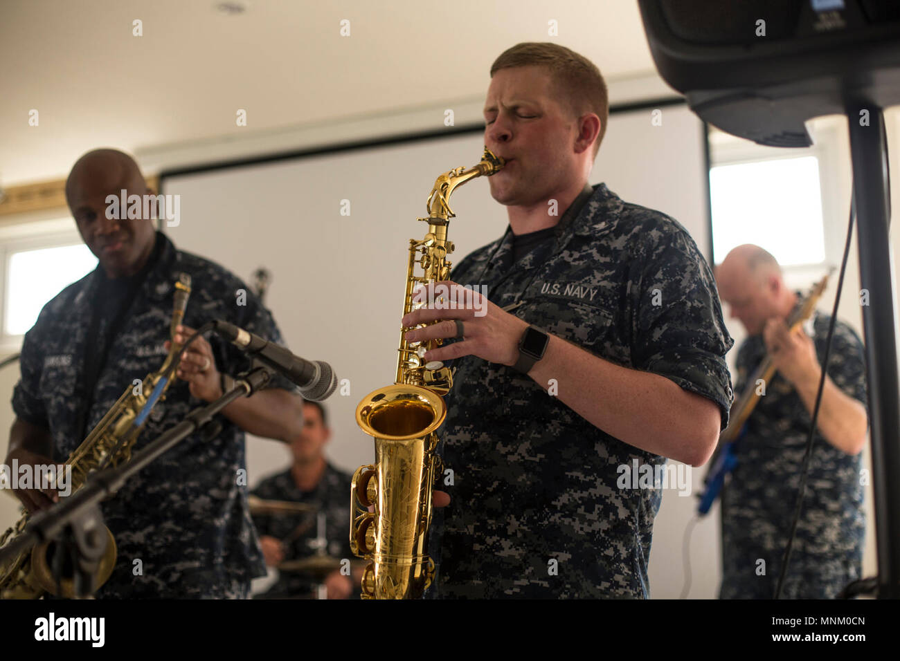PUERTO CORTES, Honduras (March 17, 2018) Musician 3rd Class Kent Grover, of Idaho Falls, Idaho, plays the alto saxophone at the Centro de Comvenciones Omoa during Continuing Promise 2018. U.S. Naval Forces Southern Command/U.S. 4th Fleet has deployed a force to execute Continuing Promise to conduct civil-military operations including humanitarian assistance, training engagements, and medical, dental, and veterinary support in an effort to show U.S. support and commitment to Central and South America. Stock Photo
