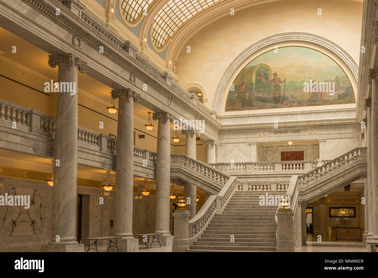 Salt Lake City, Utah, USA - May 3, 2018: Interior view of the State Capital Building and Supreme Court with mural, marble columns and staircase. Stock Photo