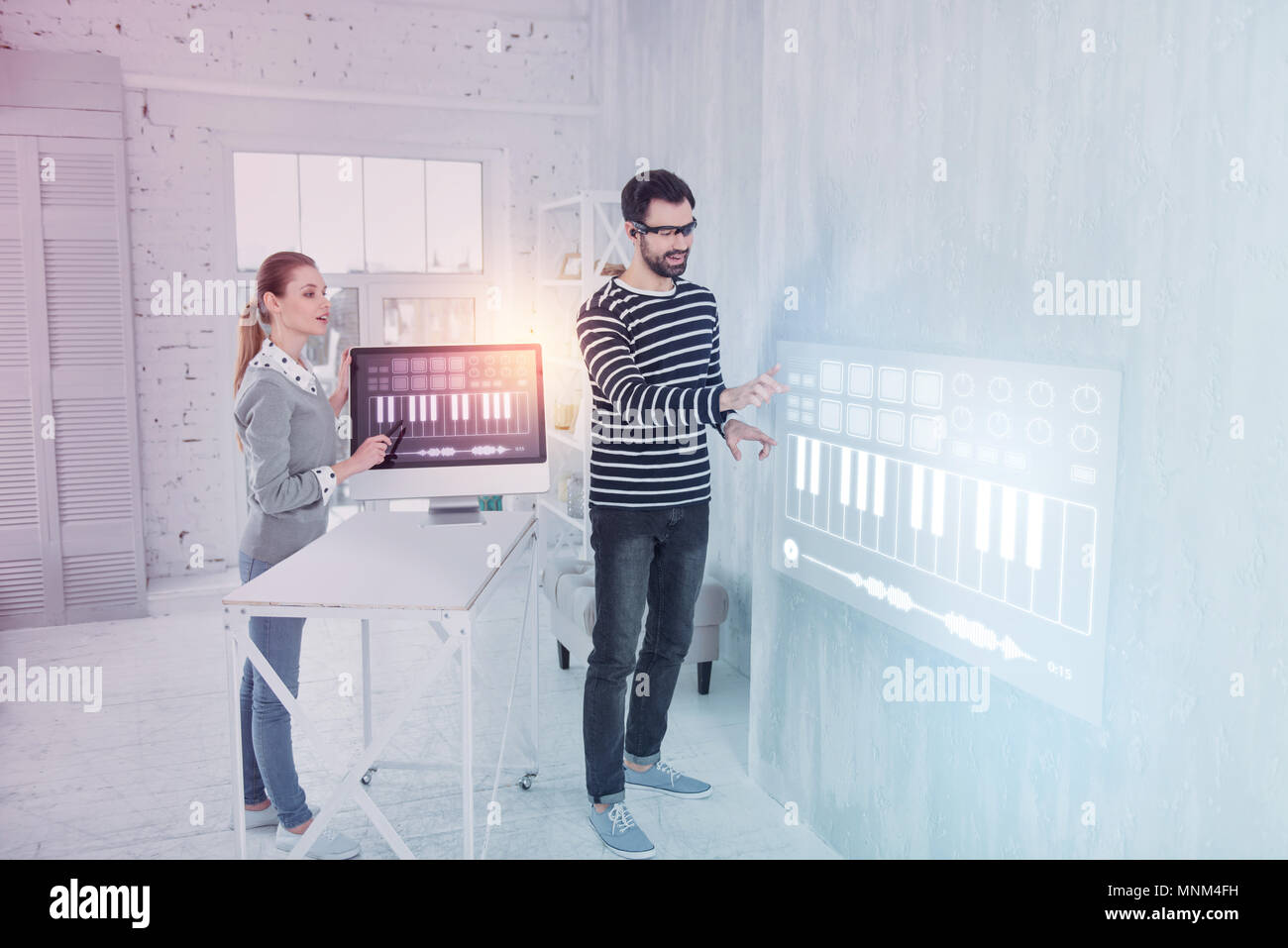Creative programmers feeling impressed while working Stock Photo