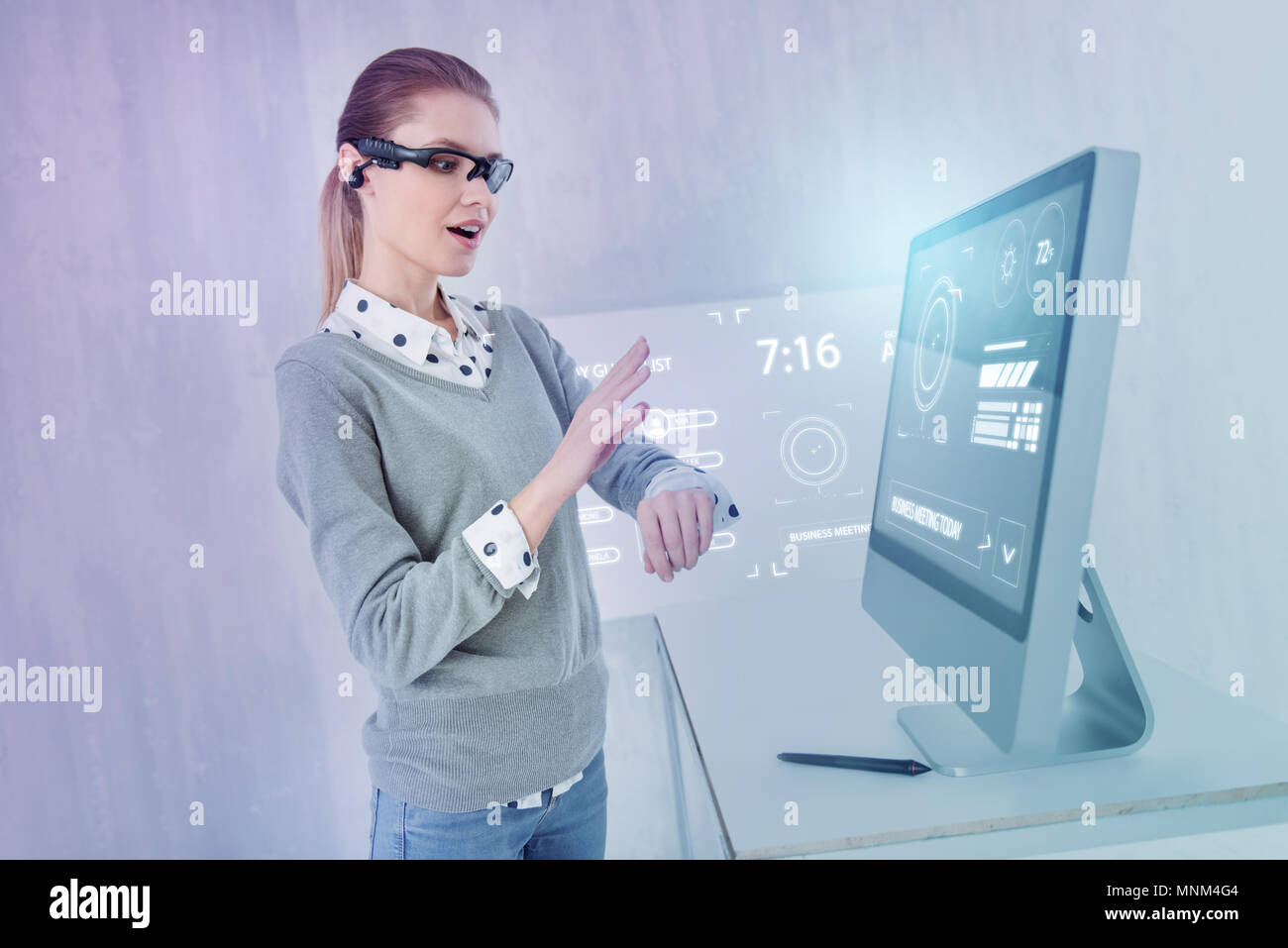 Emotional programmer feeling impressed while using new smart watch Stock Photo