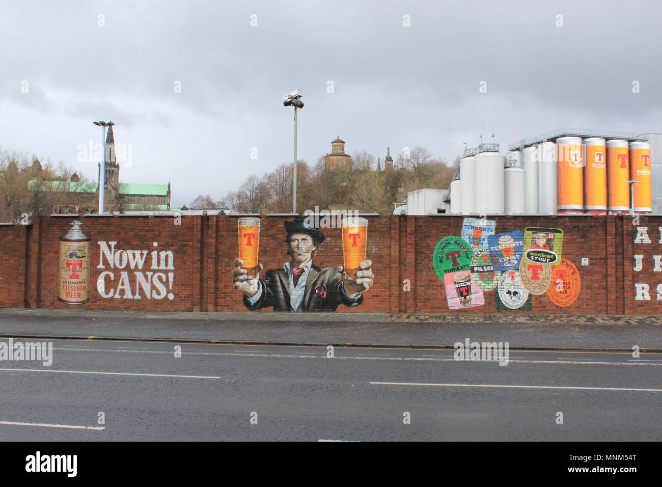Smug's Tennent's lager mural outside The Wellpark Brewery, originally known as the Drygate Brewery on Duke Street, Glasgow Stock Photo